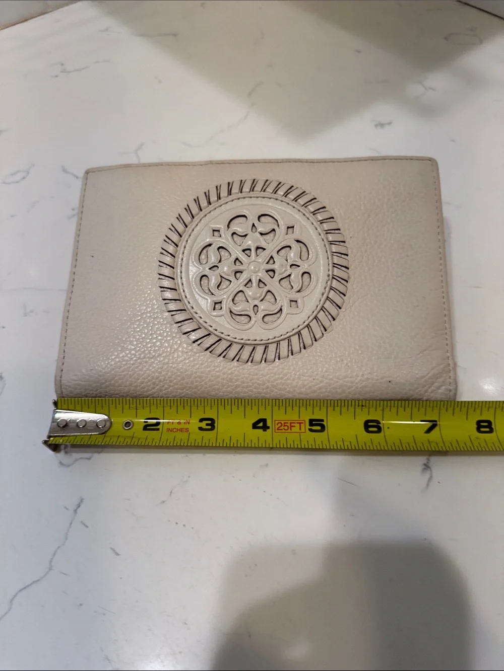 Brighton Cream Pebbled Leather Ferrara Fold Wallet with Embossed Medallion
